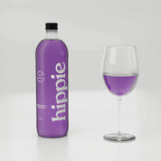 Hippie Dragon Fruit kombucha 750ml bottle with a glass poured